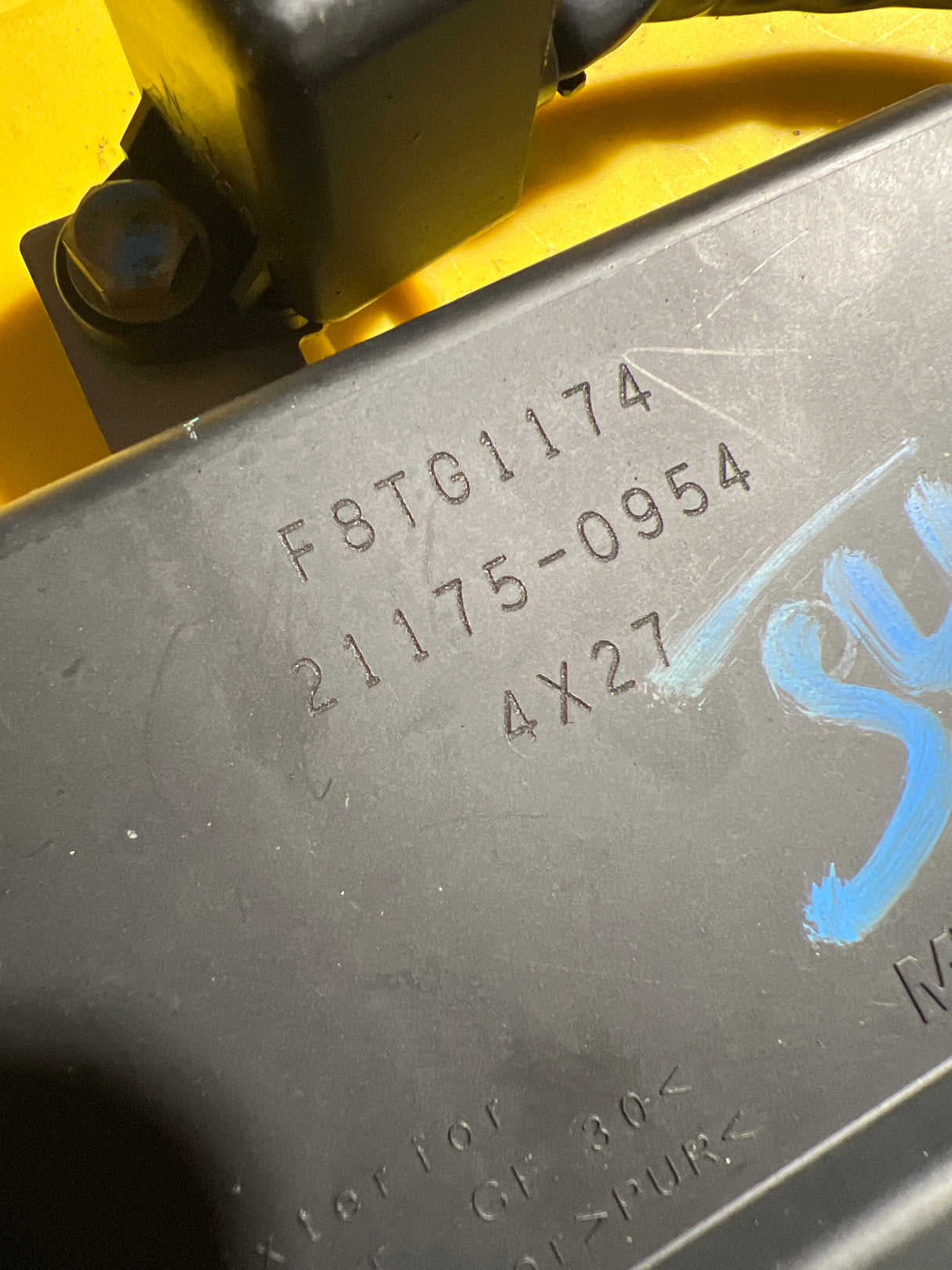OEM Kawasaki ECU with programming key, electrical part from MIAMIJETSKIMOTORSPORTS, showing the ECU unit and key components.