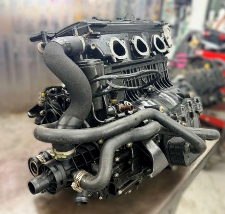 Pre-owned 2024 Sea-Doo GTI SE 170 engine with ACE 1630 and iDF system, showing the complete engine assembly.