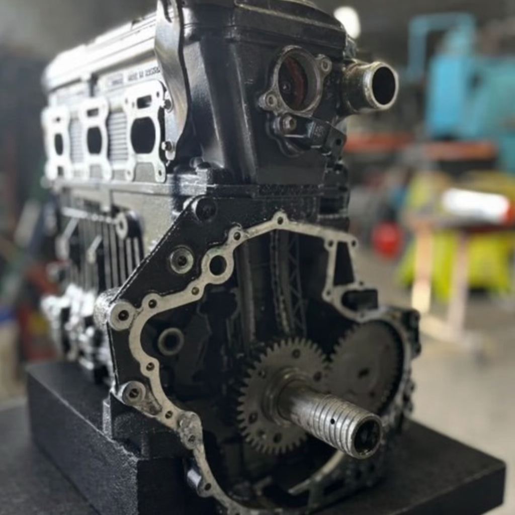 Remanufactured Sea-Doo 215 engine by Miami Jet Ski Motorsports, 1500cc, ready for installation, with detailed engine parts visible.