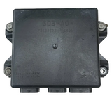 Black electronic module with visible branding on a perforated metal background