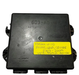 Black electronic component with a yellow label on a gray background