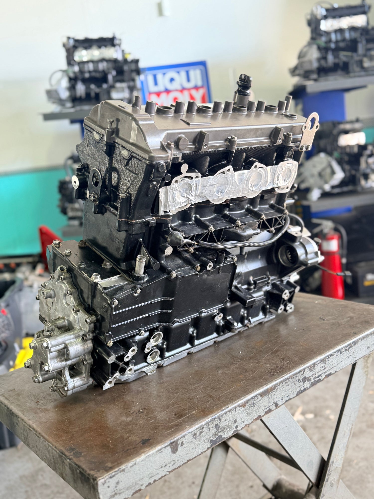 Yamaha 1.8 High Output (1800 HO) remanufactured engine from MIAMIJETSKIMOTORSPORTS, showing engine with natural intake and core exchange label.